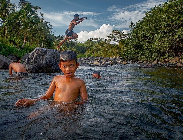 Children swimming in the river in Sidemen - Bali