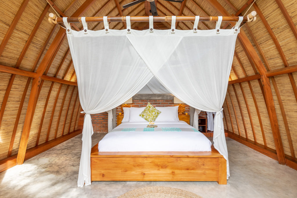 Queen size bed in the bedroom of Villa Uma Dewi Sri in Sidemen in Bali