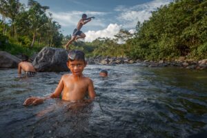 Balinese children playing in the river near the hotel Villa Uma Dewi Sri in Sidemen